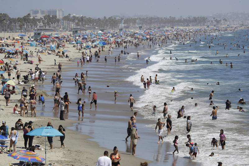 Californians hit beaches, travel ahead of virus rules easing