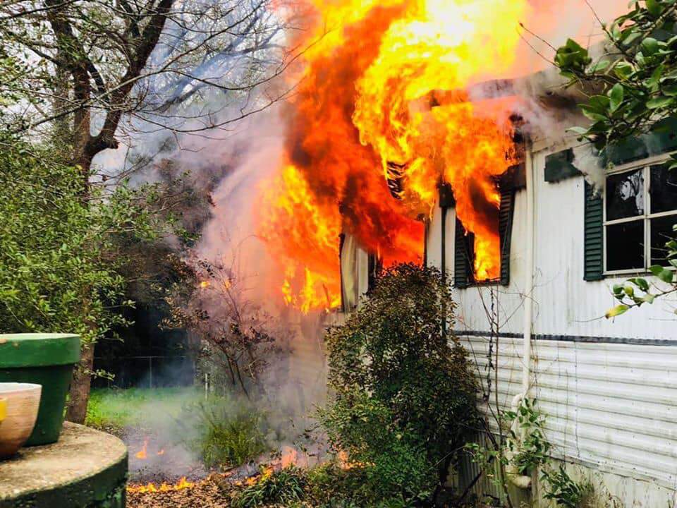 Magnolia firefighters rescue 84-year-old woman trapped inside burning home