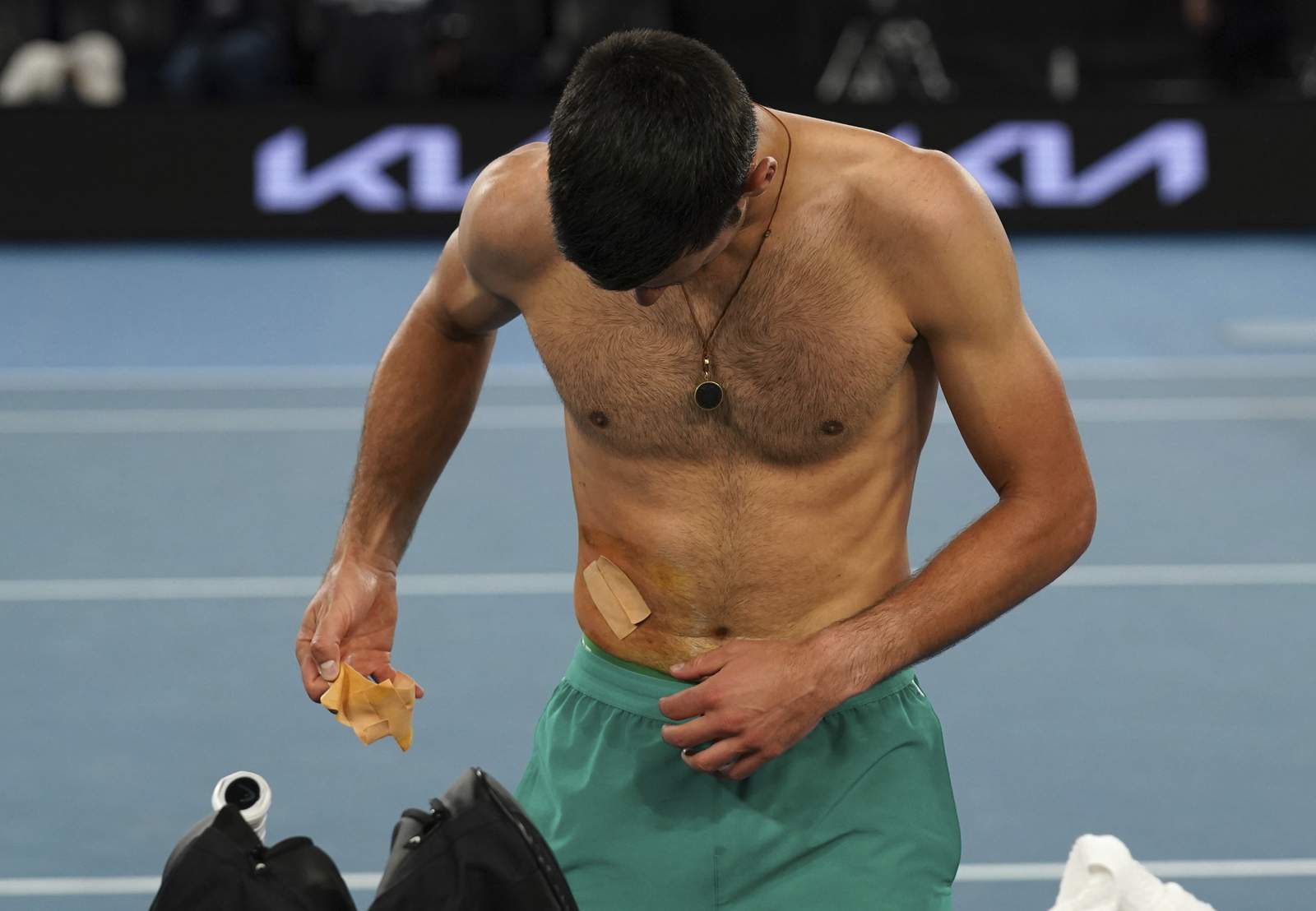 The Latest: Djokovic says he did tear muscle in Australia