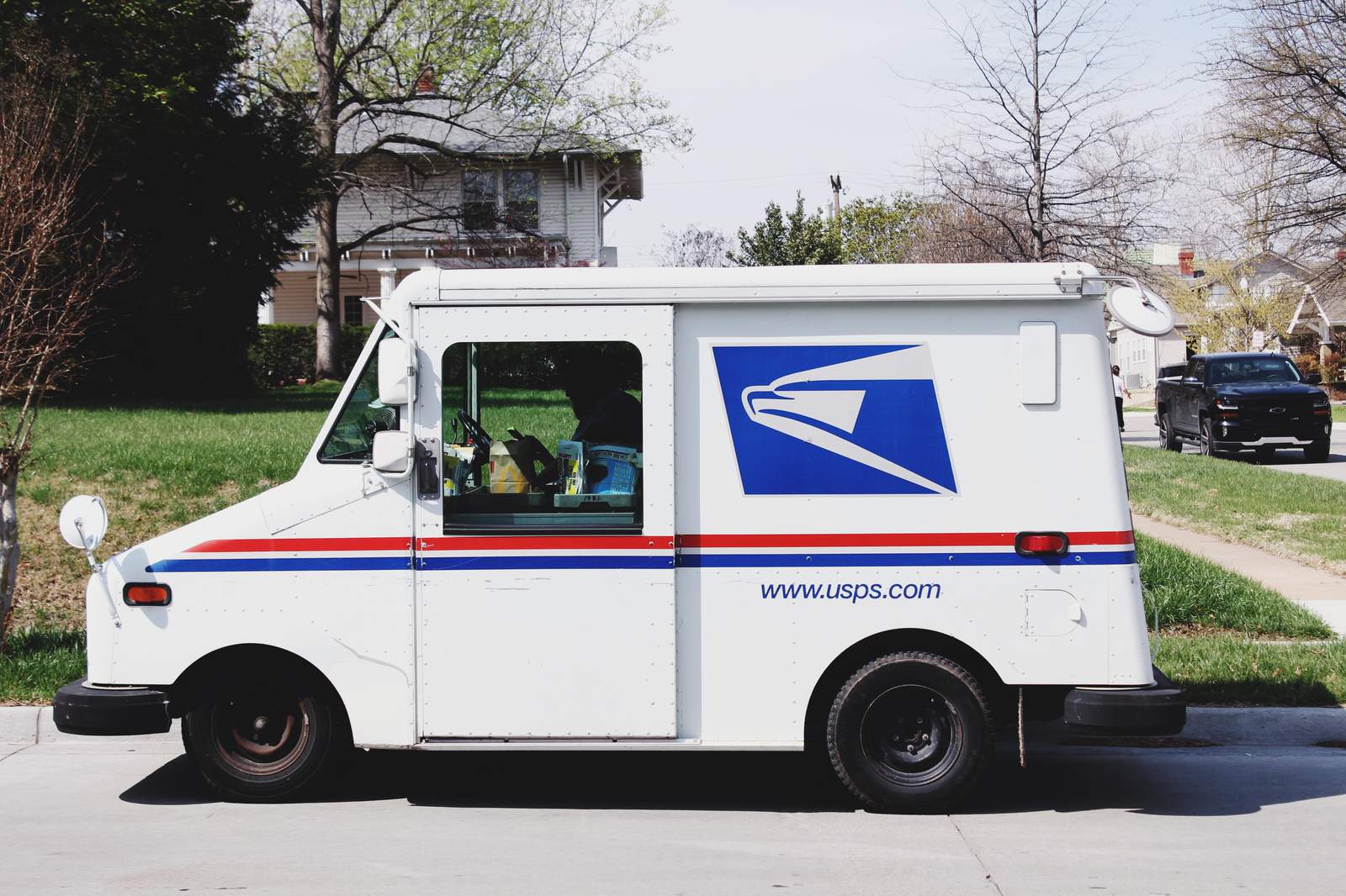 Mail carrier delivers his own celebration to the 2020 graduates on his route