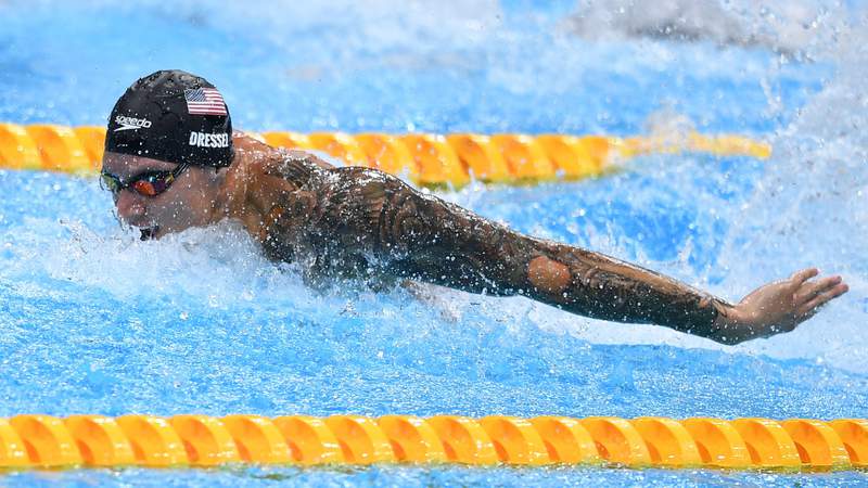 Caeleb Dressel adds 100m butterfly gold, breaks world record