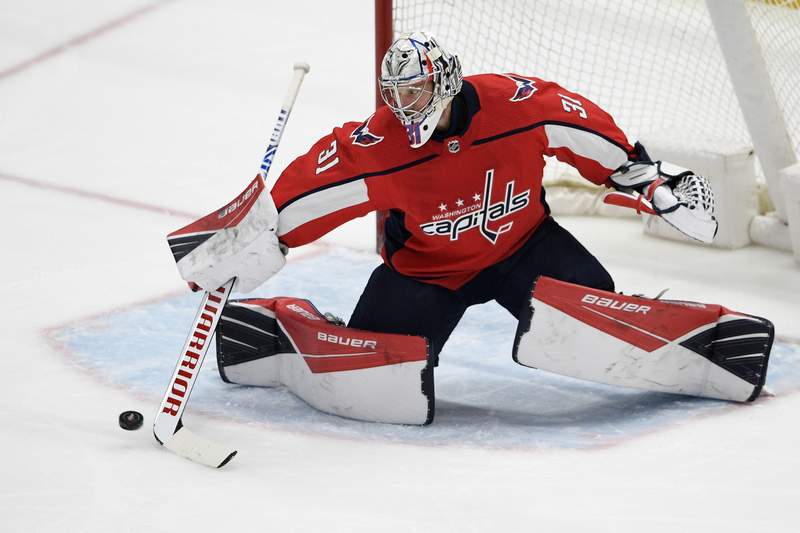 Capitals beat Flyers in overtime, Penguins win East Division