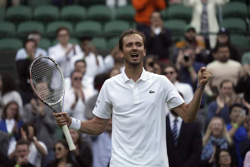 The Latest: Medvedev rallies from 2 sets down at Wimbledon