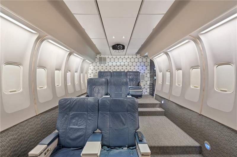 OMG -- This Texas abode on the market has an airplane cabin-themed media room