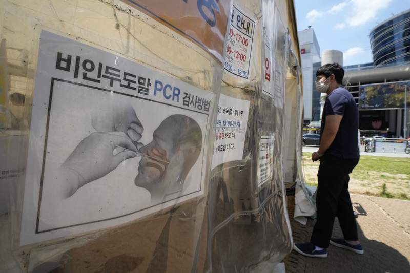 The Latest: SKorea sees 11th straight day over 1,000 cases