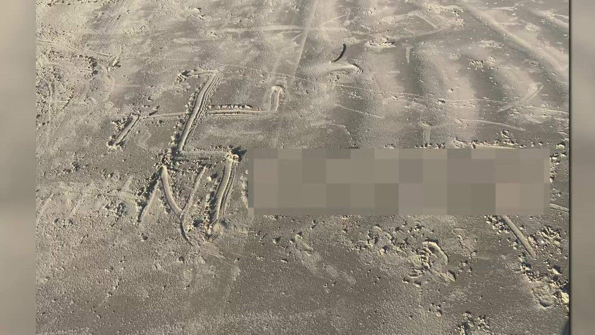 Woman finds racist message written in sand behind beach house in Galveston
