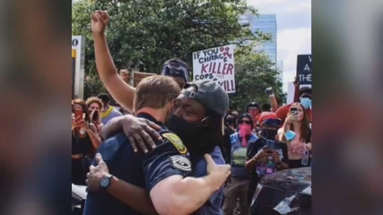 Photo of protester embracing HPD officer captures moment of unity