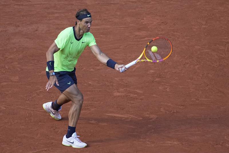 The Latest: Nadal annoyed by daytime lights at French Open