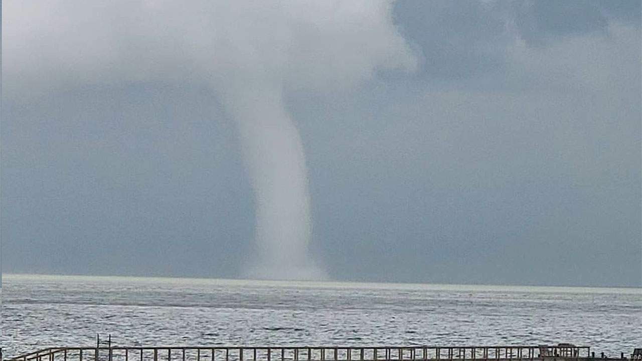 Check out these photos of a large waterspout over Galveston Bay