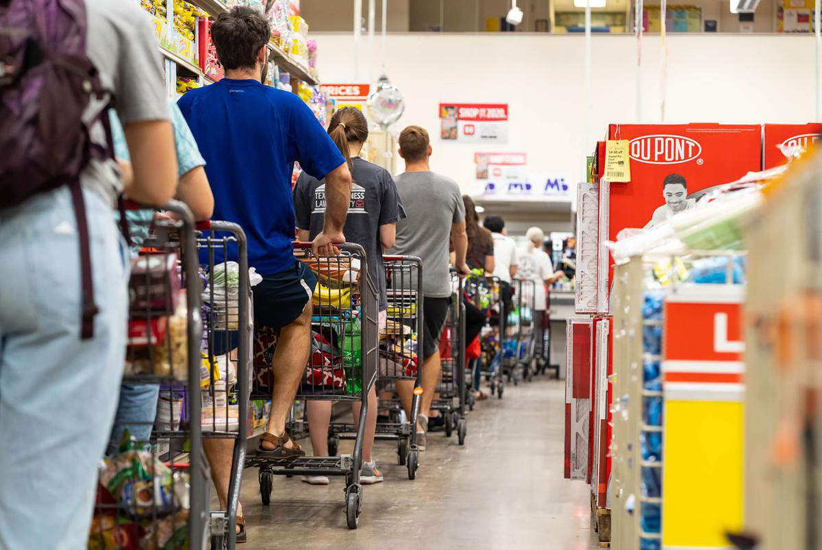 Nearly a year into the pandemic, grocery workers in Texas are more fatigued than ever as they await vaccine access