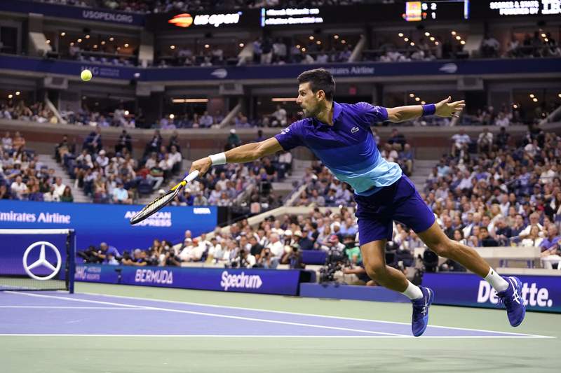 The Latest: Djokovic takes Grand Slam bid into US Open semis