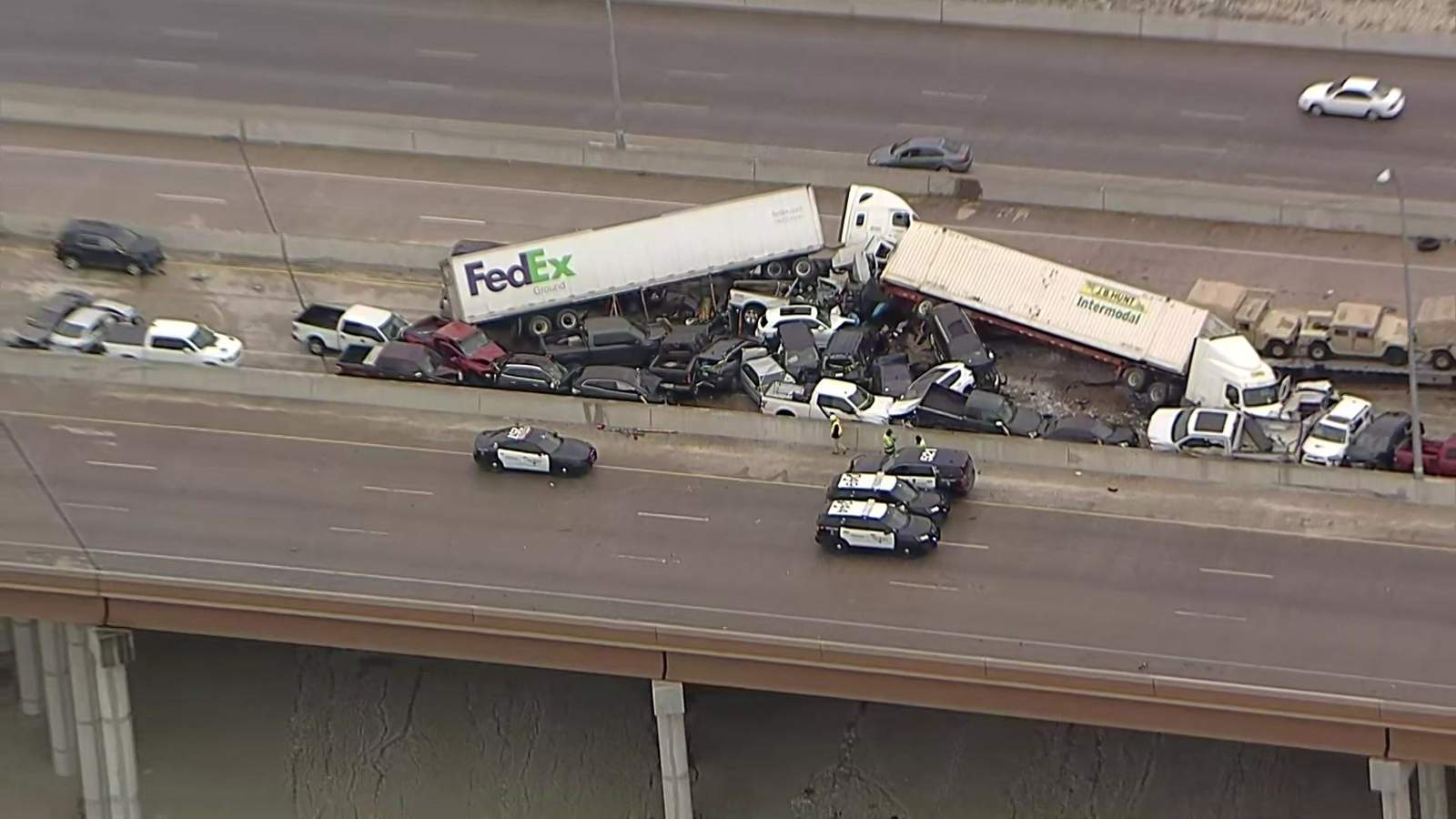 Fort Worth police say 6 people died as result of massive pileup on icy Texas interstate involving more than 100 vehicles