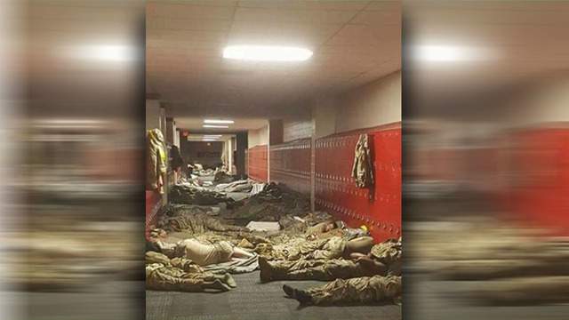 Katy sleeping National Guard photo deleted as a result of criticisms