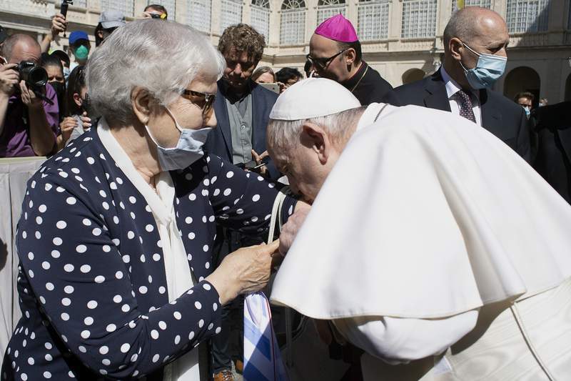 Pope kisses Auschwitz survivor’s tattoo
