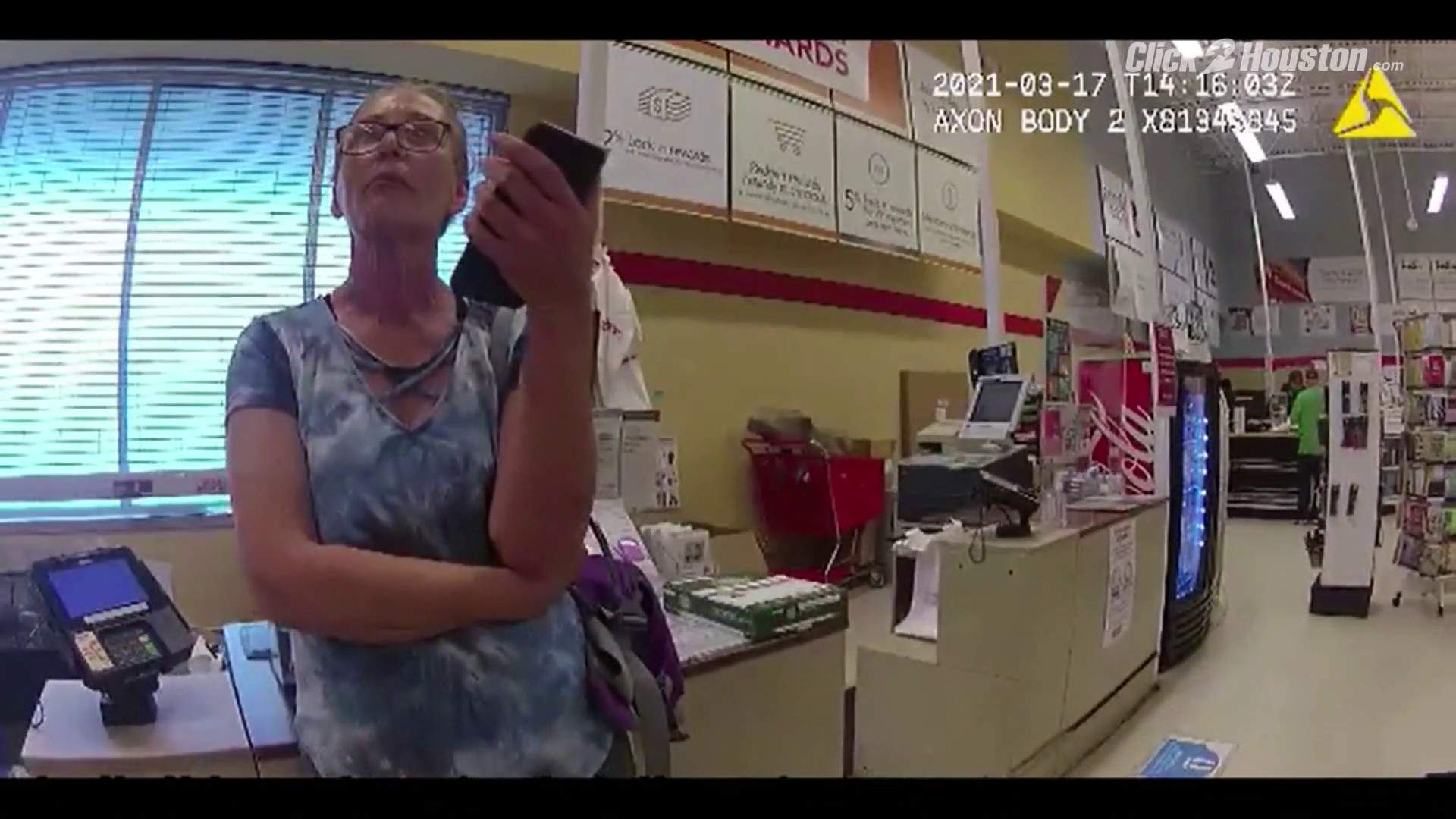 Camera footage shows the second arrest of a woman without a mask, this time at the Texas City store
