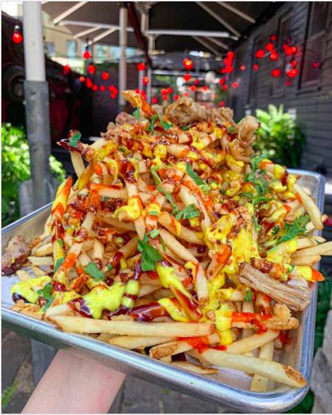 You can get wine and a free huge order of fries to-go at this Houston spot