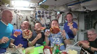 VIDEO: This is what a pizza party in space looks like