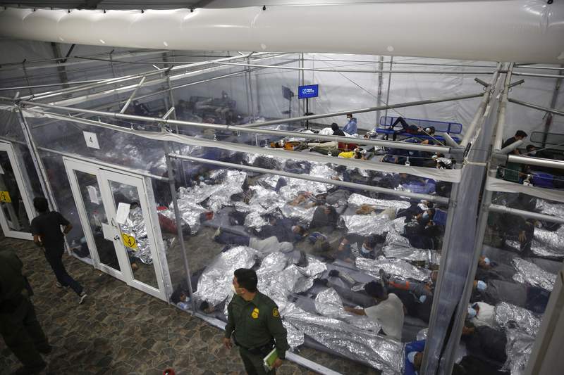 Migrant children held in mass shelters with little oversight, Associated Press reports