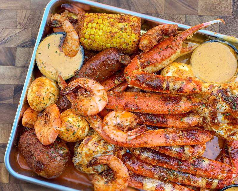 FREE kids meals? Crawfish and daiquiris happy hour? Houston’s Lotus Seafood has the whole family covered