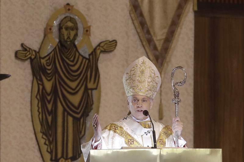 2 Catholic bishops at odds over Biden receiving Communion