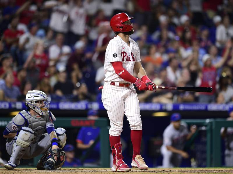 Phils win 6th straight, beat Mets to take over NL East lead