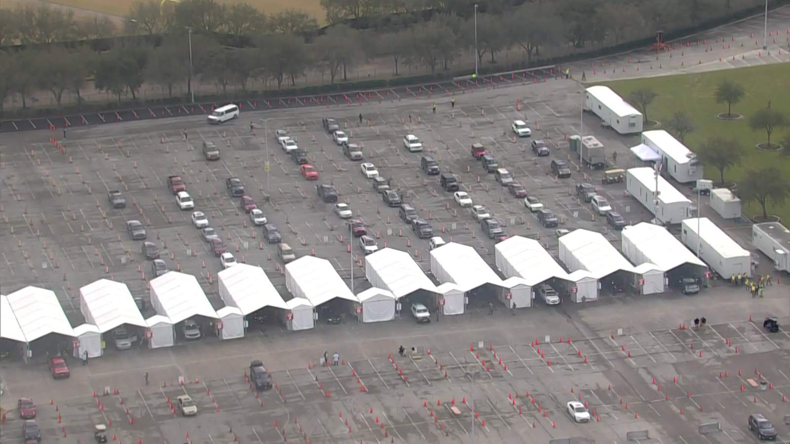 Vehicles line up at a vaccine clinic at NRG Park in Houston on Feb. 26, 2021.