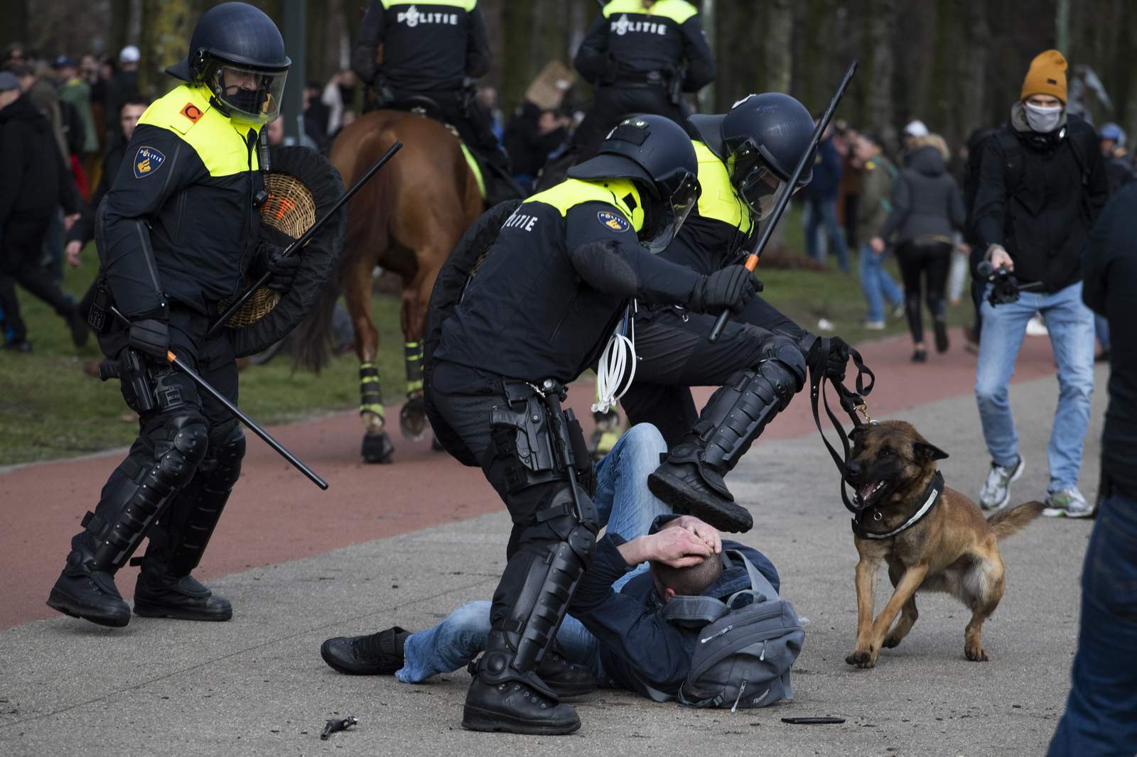 Dutch police break up anti-govt protest on eve of election