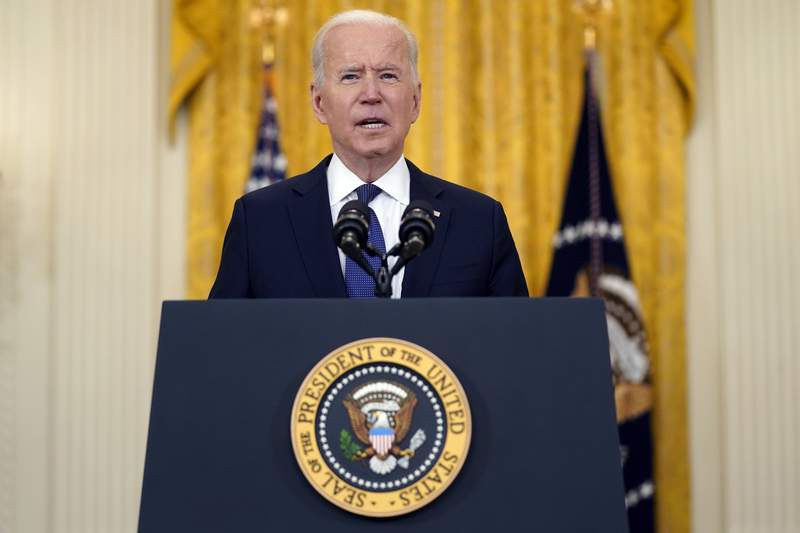 Biden approval buoyed by his pandemic response, poll suggests