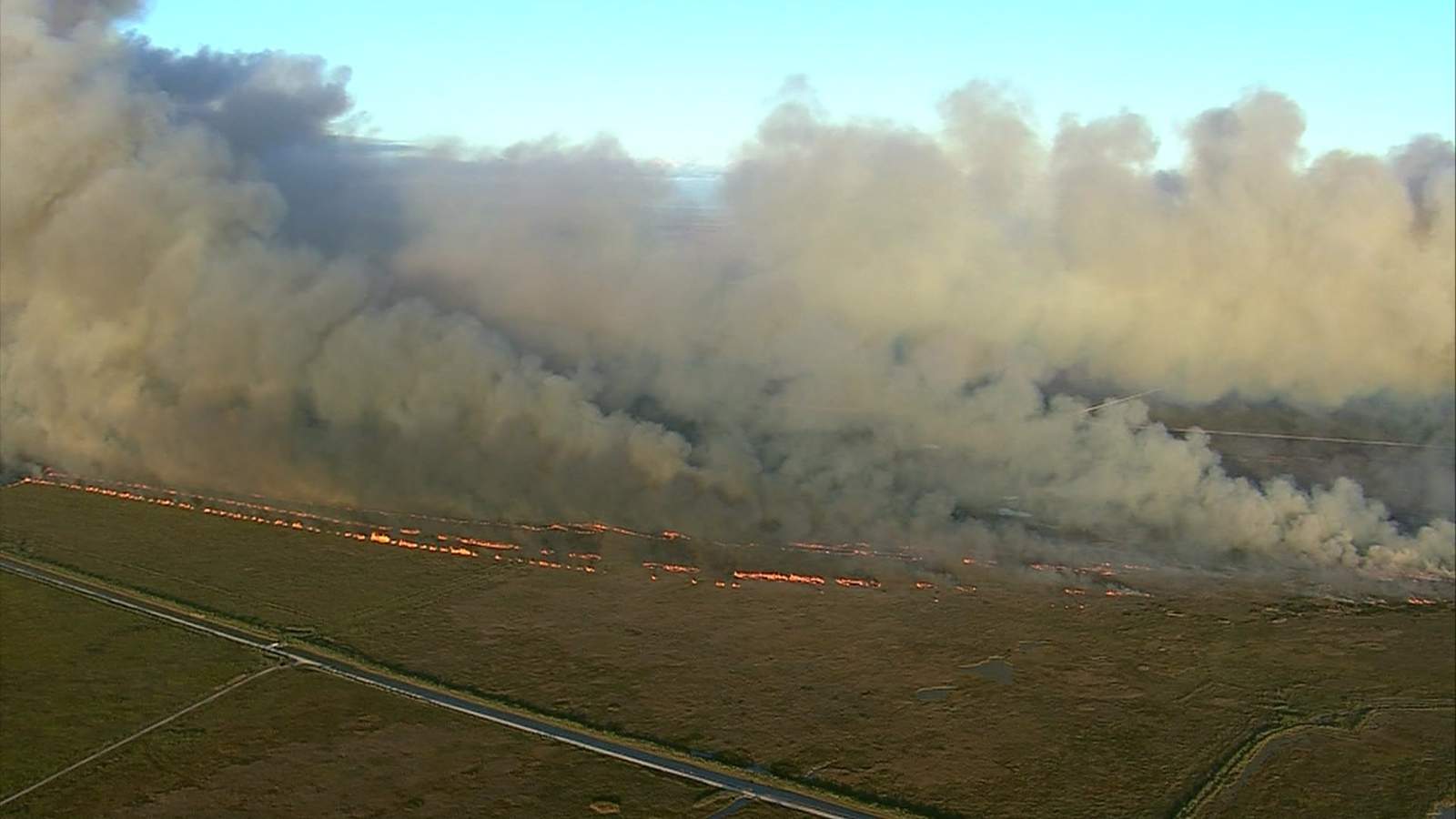 Firefighters battle large wildfires at national wildlife refuge in Chambers County