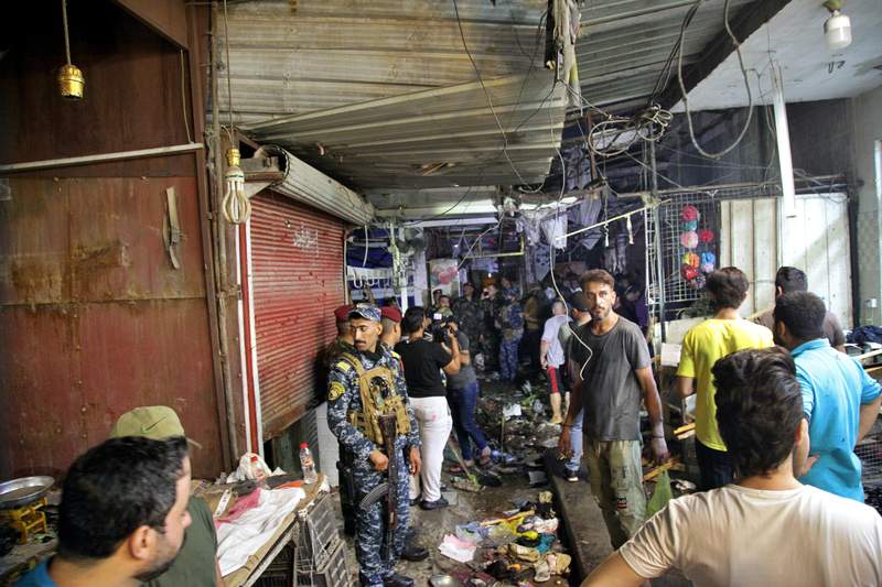 Iraqi officials: Roadside bomb kills 25 in Baghdad market