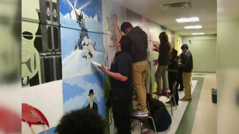 Retired art teacher, former students disappointed after school paints over campus murals