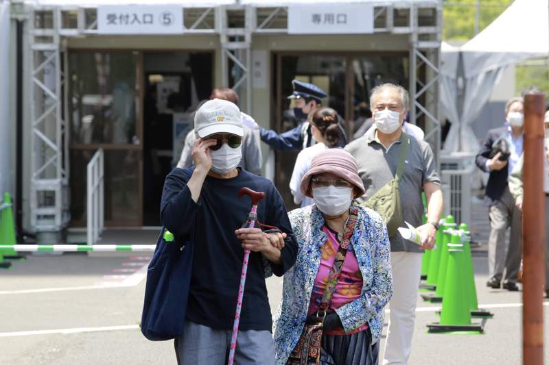 Japan opens mass vaccine centers 2 months before Olympics