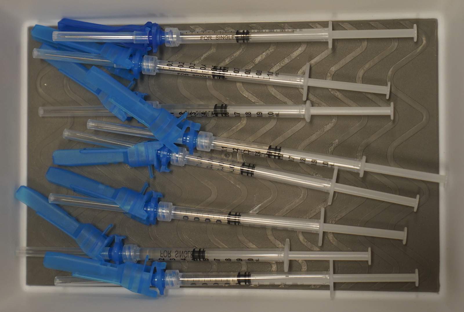 A medical tray holds syringes with the vaccine on the first day of the Johnson and Johnson vaccine being made available to residents at the Baldwin Hills Crenshaw Plaza in Los Angeles Thursday, March 11, 2021. (AP Photo/Damian Dovarganes)