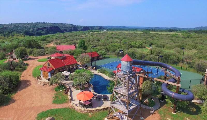 Over-the-top Texas vacation rental has a 4-story waterslide, party shed and more