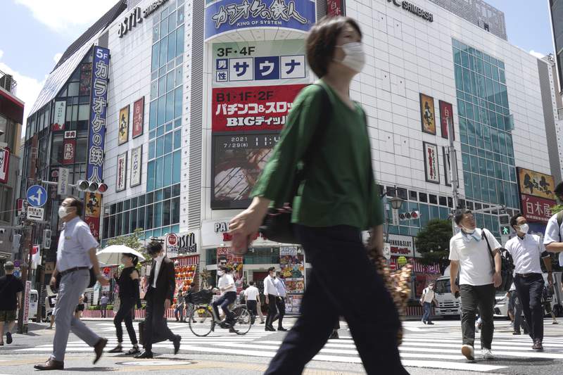 Officials in Tokyo alarmed as virus cases hit record highs