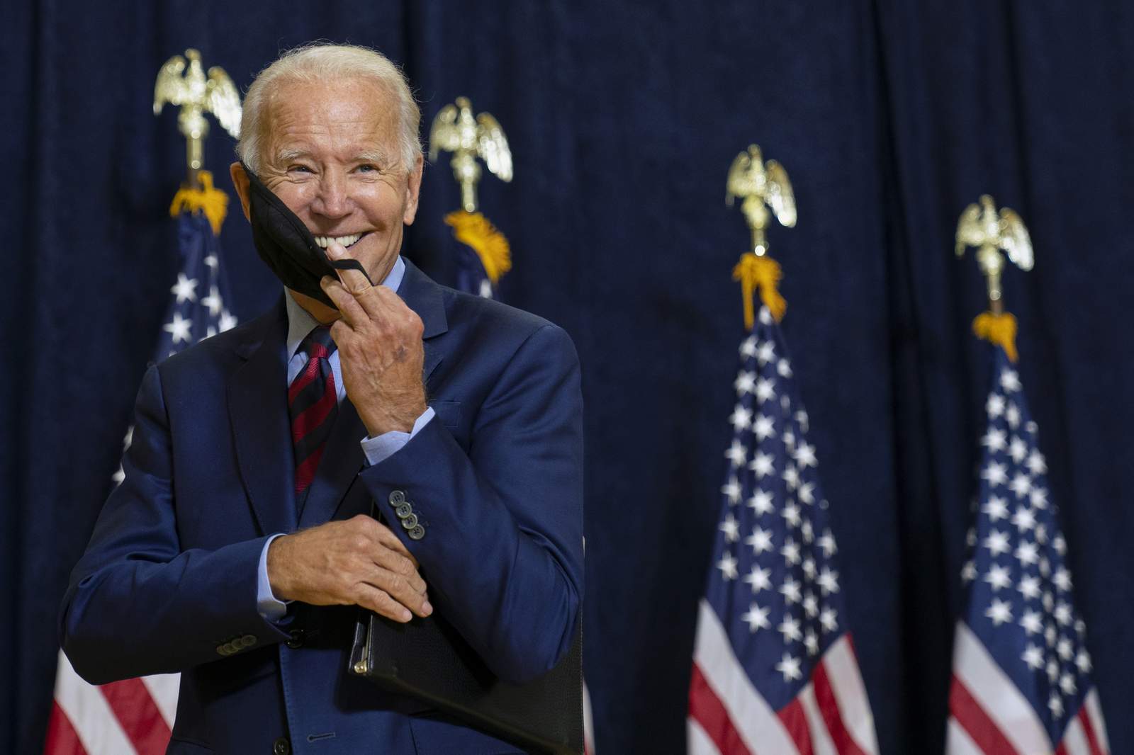 Biden names liberal econ team as pandemic threatens workers