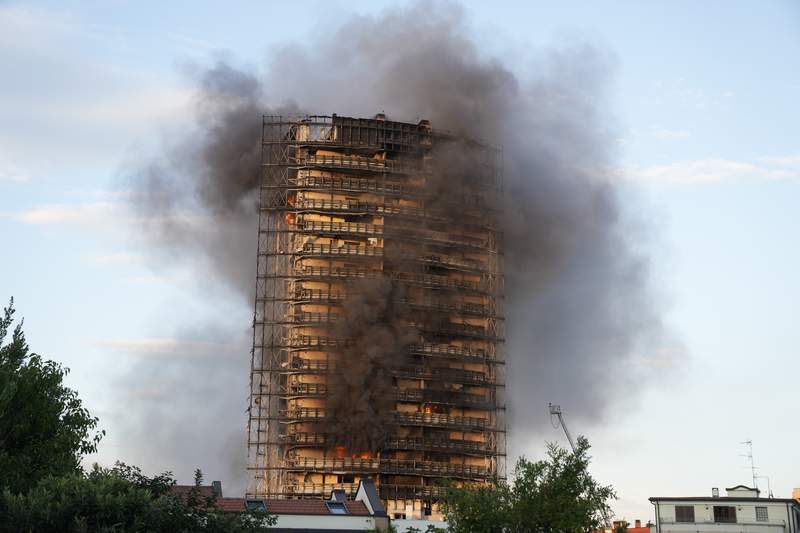 Flames consume high-rise in Milan; residents evacuated