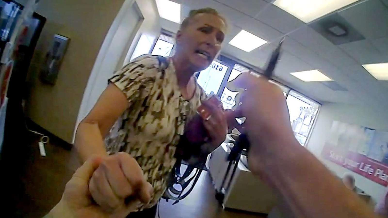 Maskless woman seen in body-cam bank video arrested after incident at another business, officials say