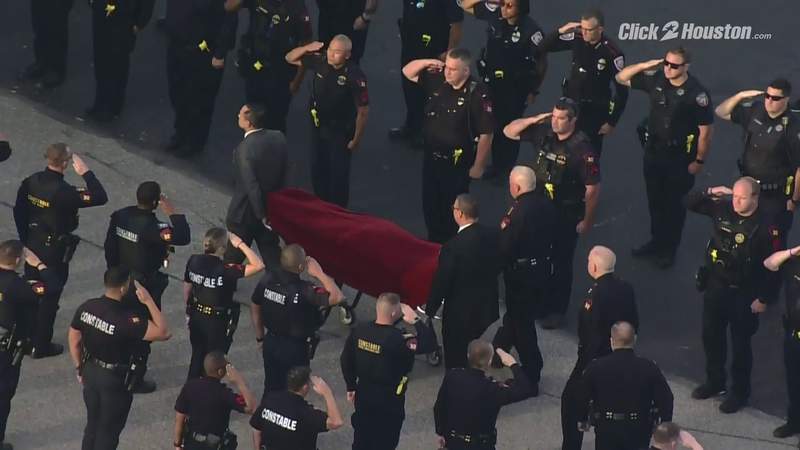 Body of slain Pct. 4 Deputy Kareem Atkins escorted to funeral home