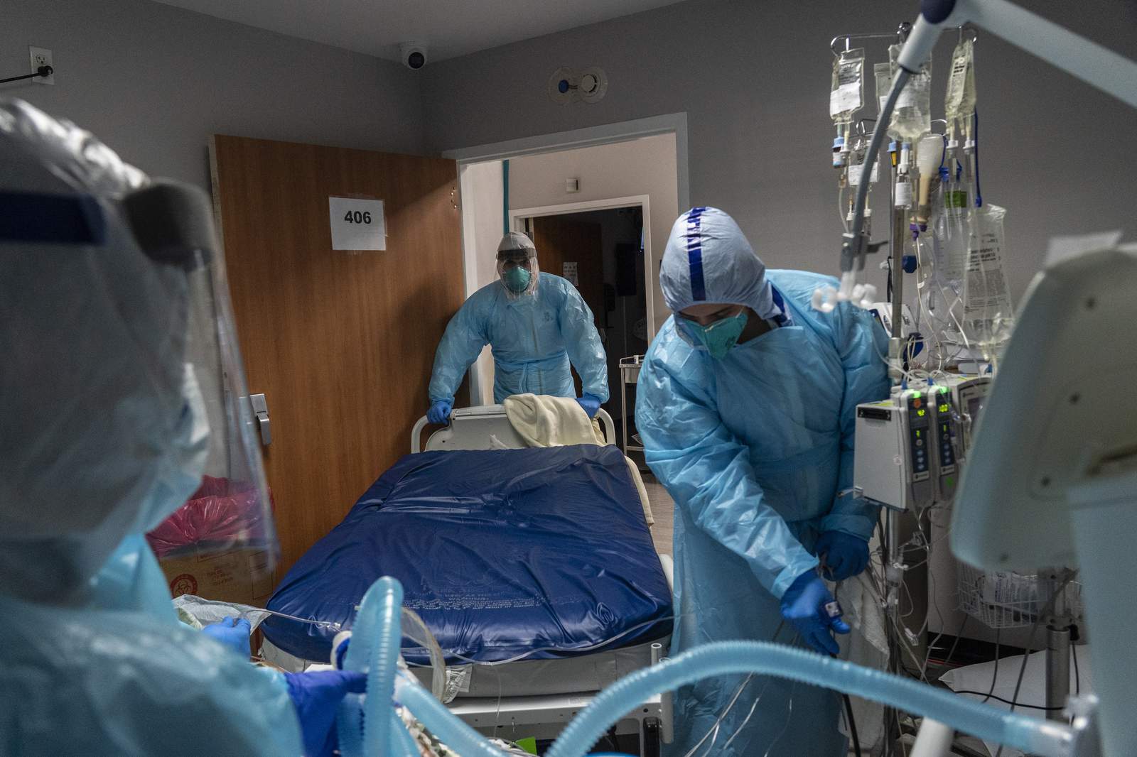 Texas hits new virus hospitalization record, passing 12,000
