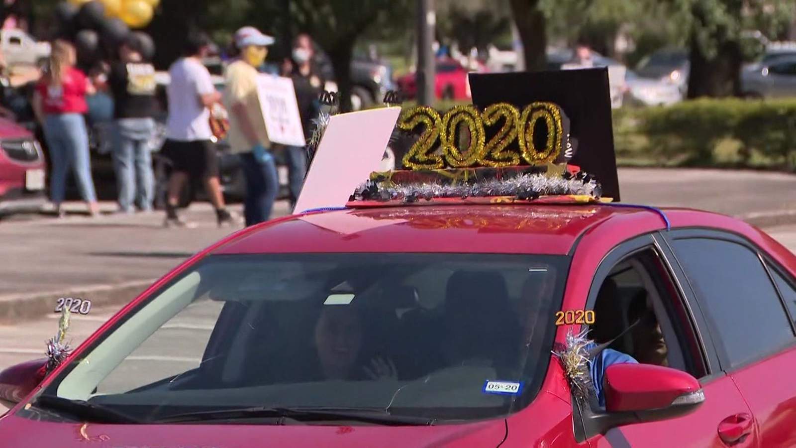 Wunsche HS seniors get drive-thru caps and gowns and car parade to celebrate graduation