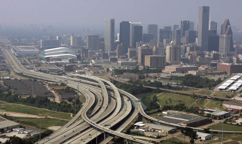 FILE - This Sept. 22, 2005 file photo shows Houston, Texas. Three metro areas in the Lone Star State had some of the biggest population gains over the past decade, according to figures released Thursday, March 26, 2020, by the U.S. Census Bureau. Dallas increased by 1.2 million people, the most of any U.S. metro area, followed by Houston, which added another 1.1 million residents over the decade. Austin grew by more than a half million residents from 2010 to 2019, the eighth biggest numeric growth among U.S. metros, according to the bureau's population estimates.(AP Photo/Pat Sullivan, File)