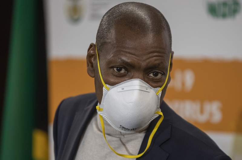 South Africa's health minister put on leave over contract