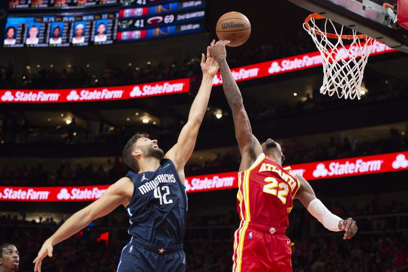 Young, Hawks open season with 113-87 rout of Mavericks