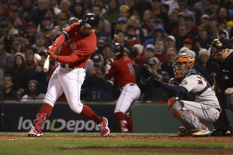 Boston Red Sox's Kyle Schwarber hits a grand slam home run against the Houston Astros during the second inning in Game 3 of baseball's American League Championship Series Monday, Oct. 18, 2021, in Boston. (AP Photo/Winslow Townson)