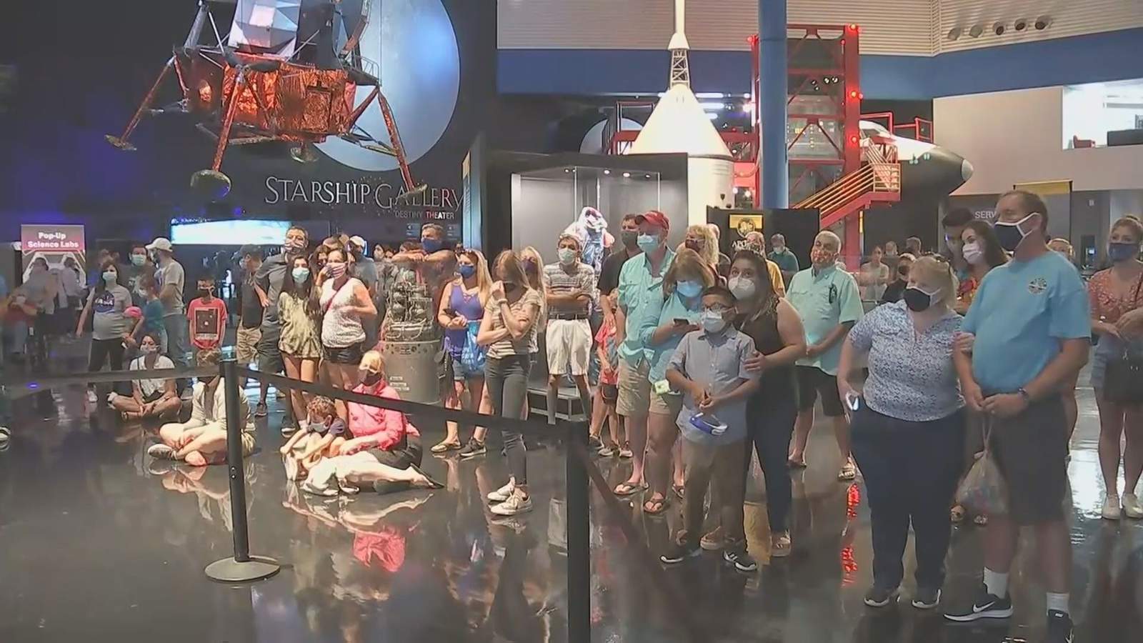 Locals gather to watch SpaceX splashdown at Johnson Space Center