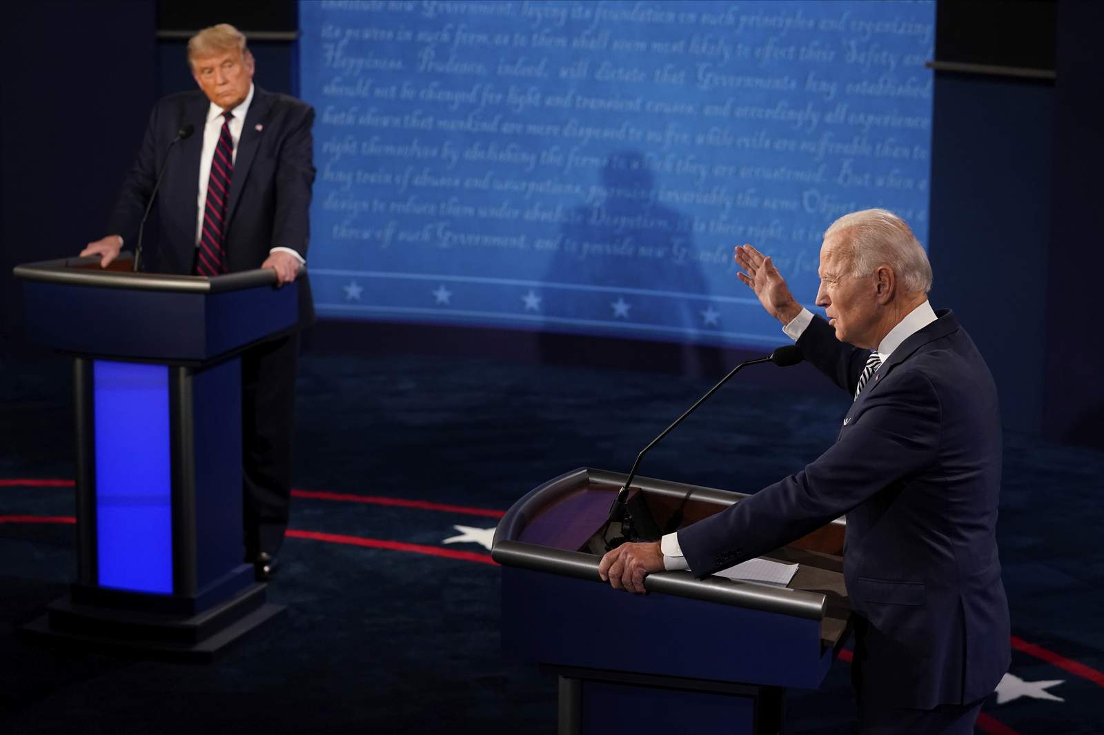 The Latest: Trump interrupts Biden, Biden calls him a clown