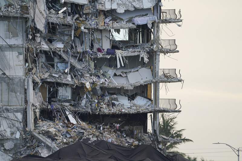 Explosives set off to bring down rest of collapsed condo