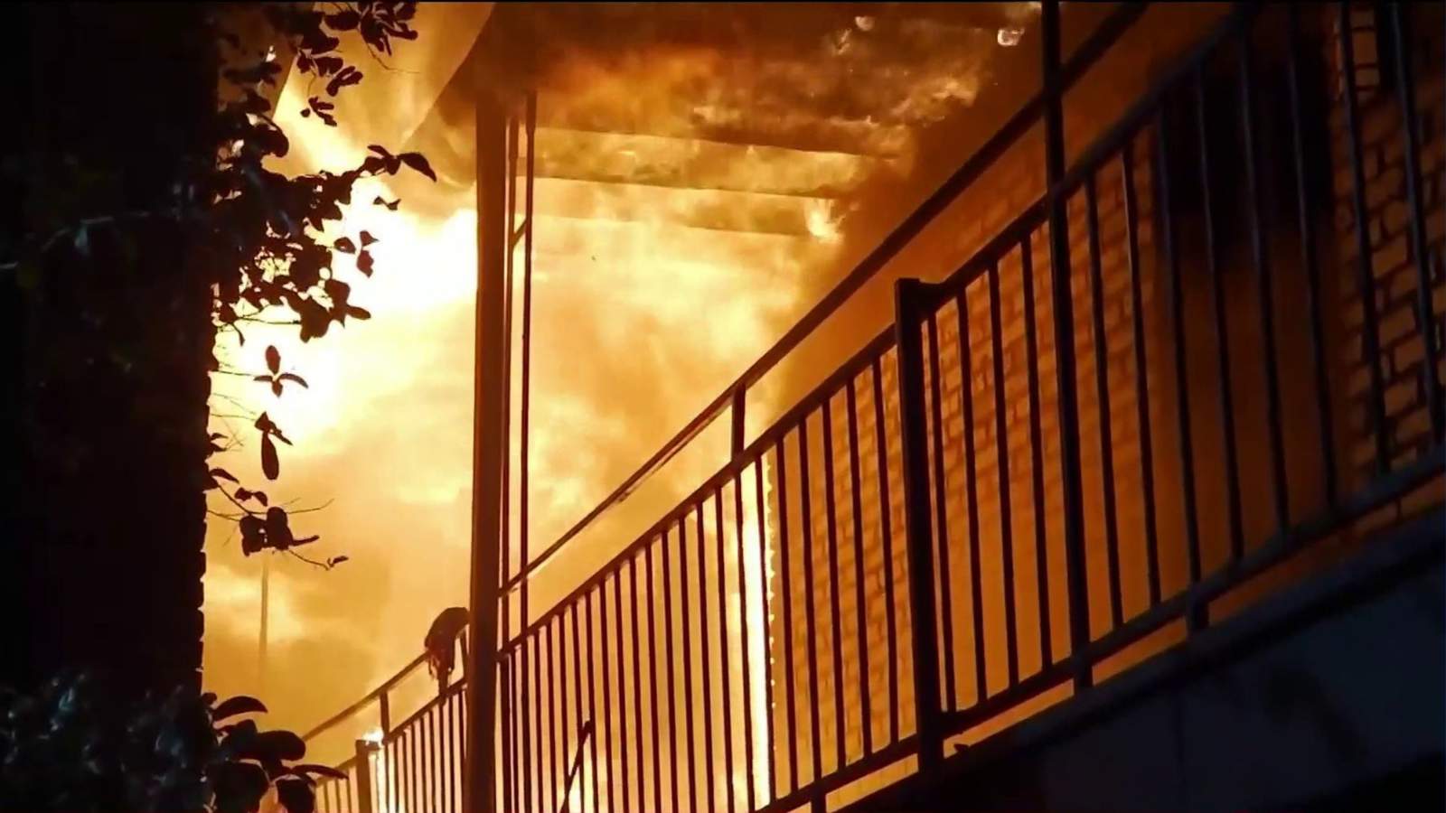 2 firefighters fall from second floor while crews battle apartment fire