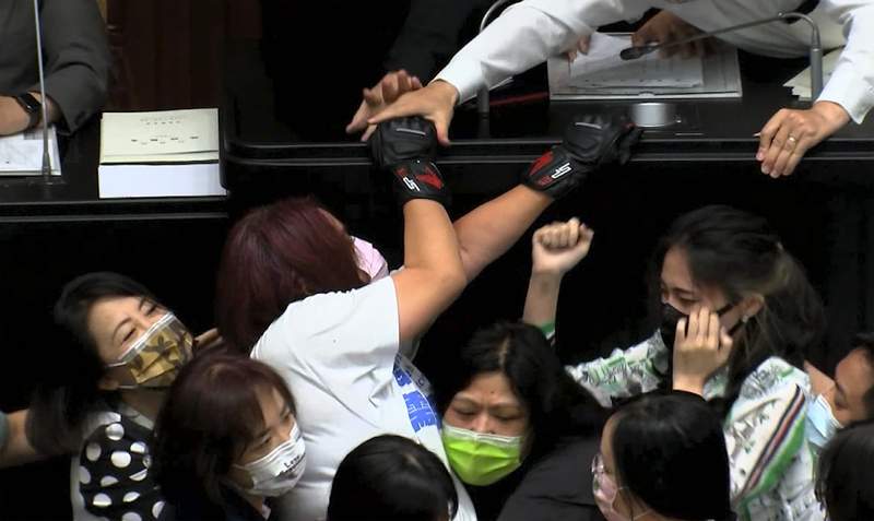 Taiwan lawmakers brawl as opposition assails COVID-19 policy